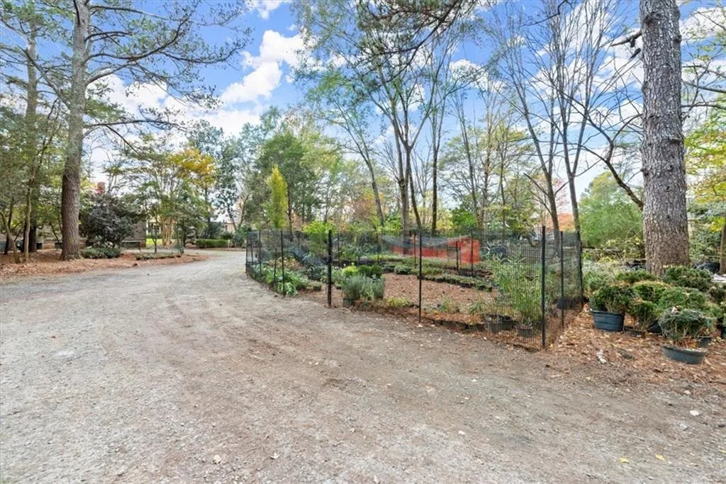Second driveway and landscaping business (also available for sale).