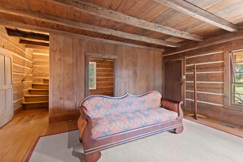 Guest house living room, with bedroom and steps upstairs behind
