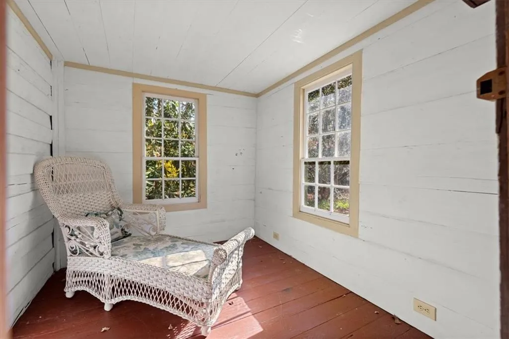 Small unconditioned space off the front porch of the guest house. Great reading nook or garden shed