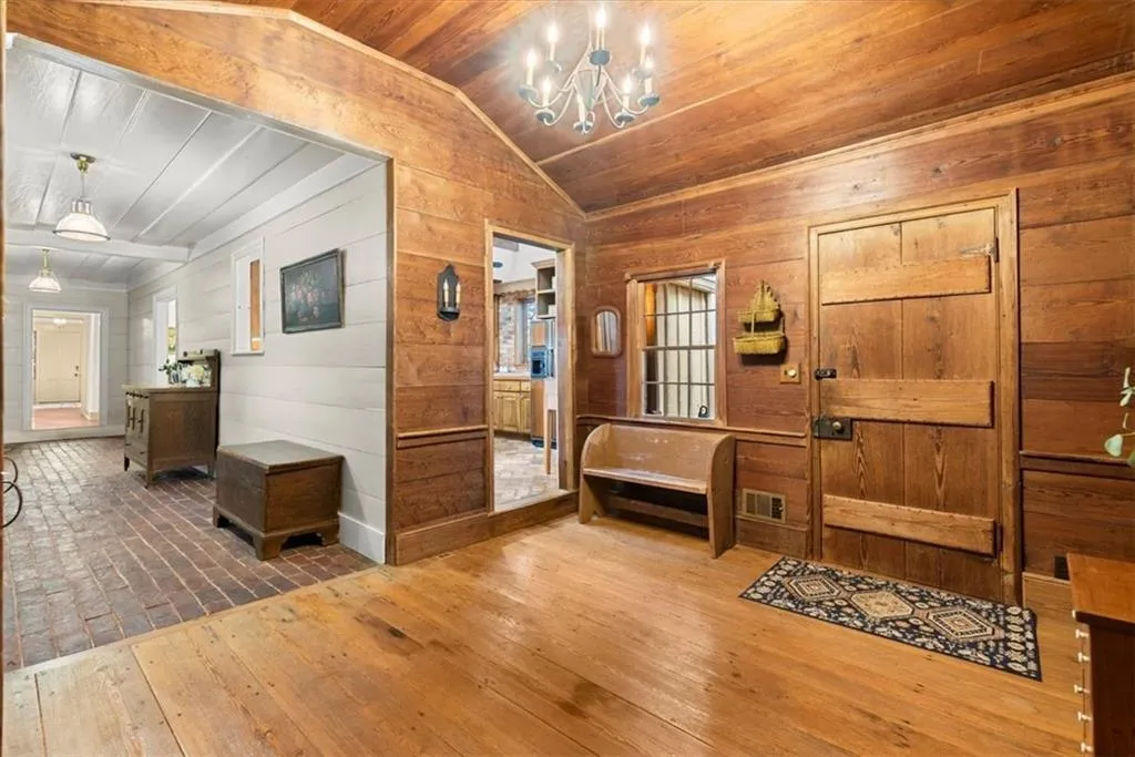 The side entrance is a huge mudroom with access to the kitchen, sunroom, laundry and family room