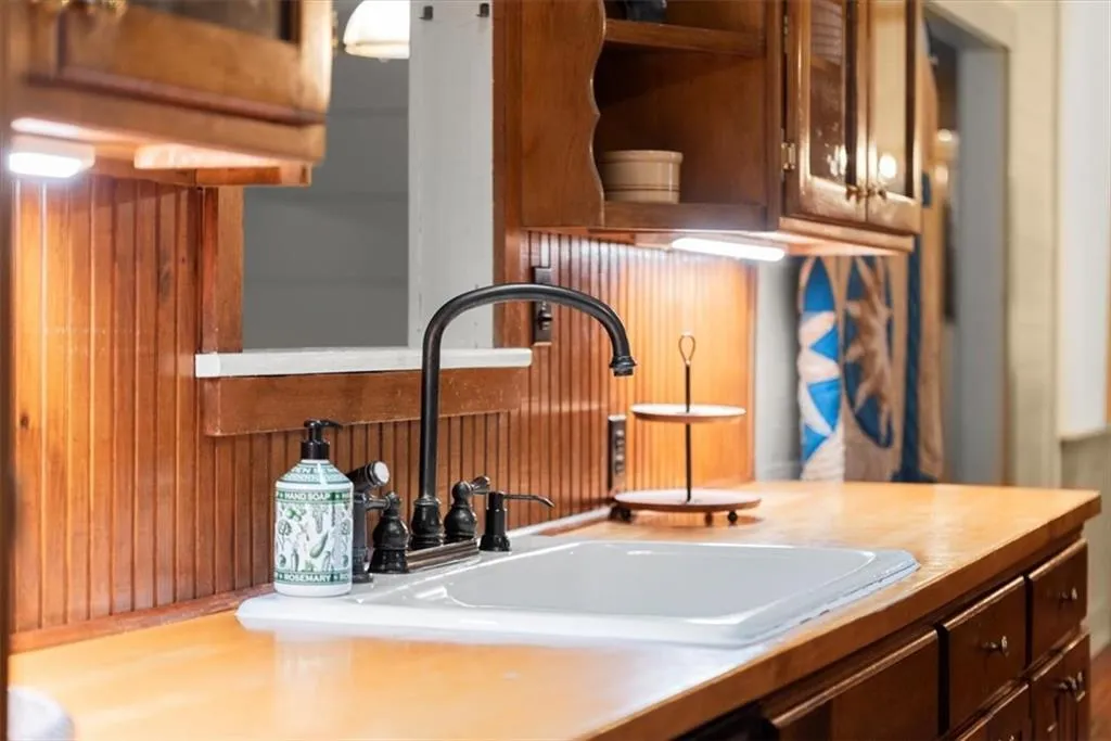 Kitchen sink overlooks sunroom