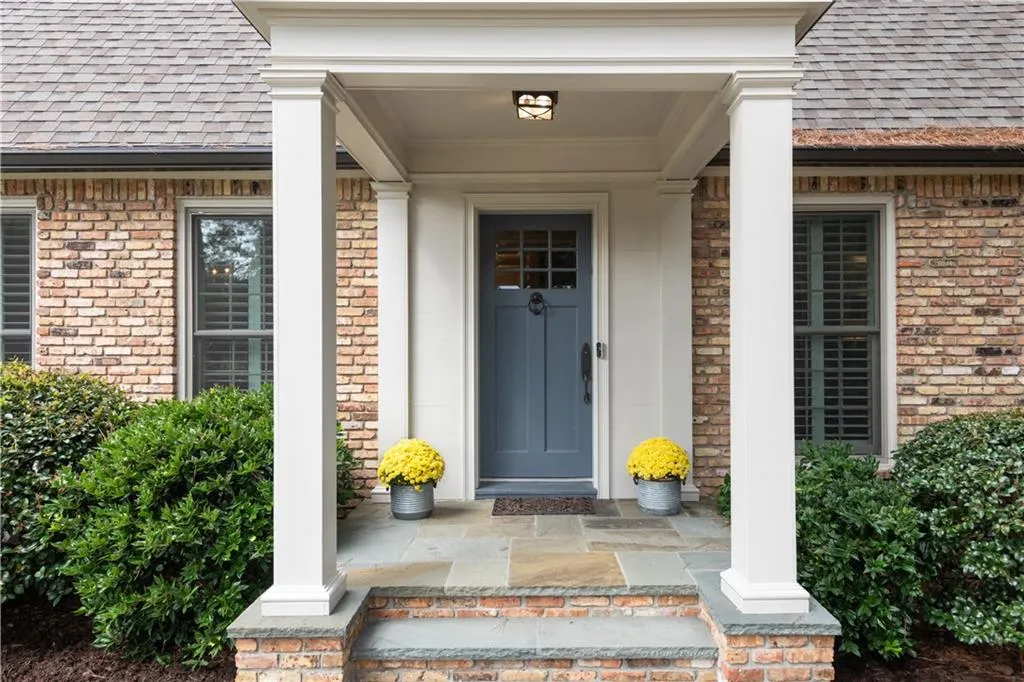 Covered front porch welcomes guests.