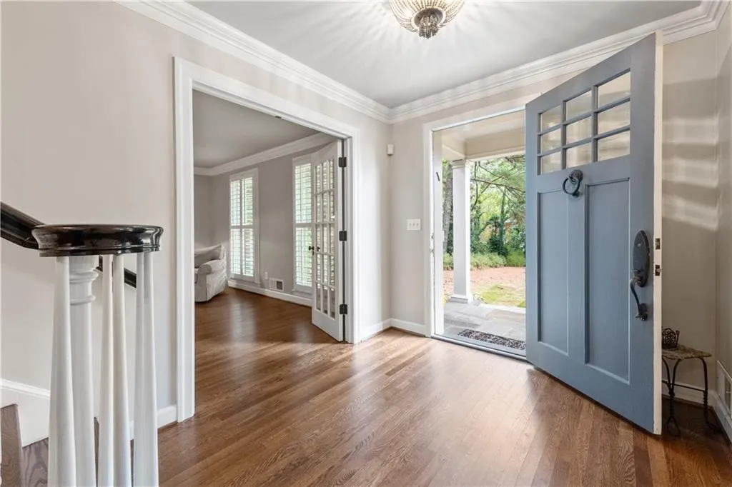 Main entry foyer connects with den and main living areas