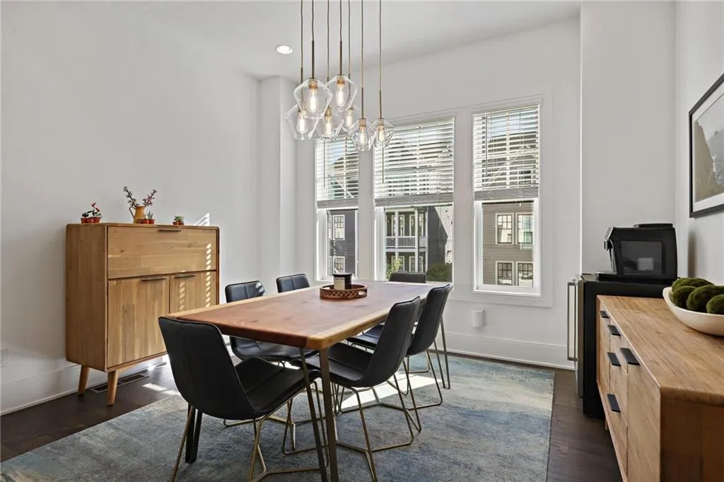 Welcome guests into a home built to host with an open floor plan that flows from the dream kitchen to the living room, dining room, and a covered back deck.