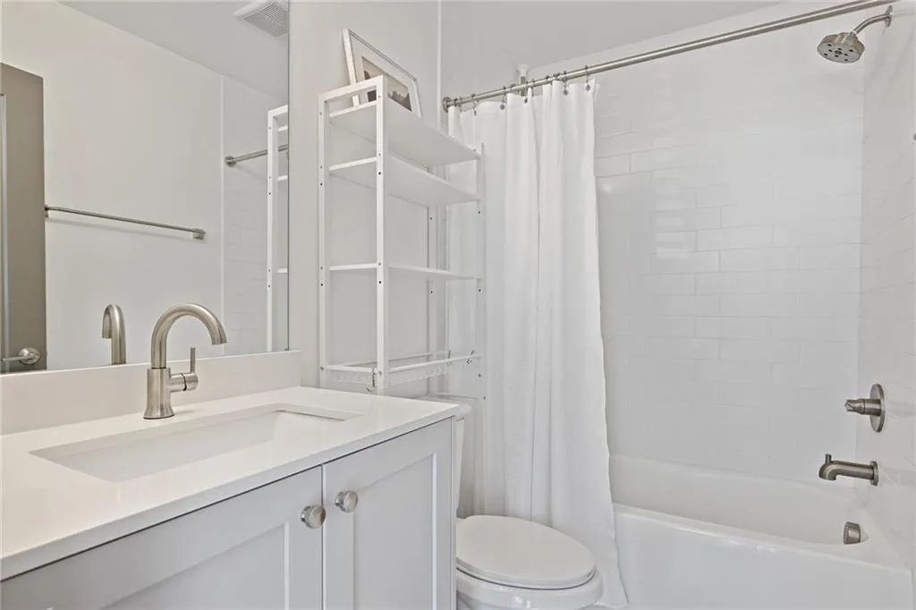 On the lower level, you will find the third bedroom with an en-suite bath that can be used as a separate home office, gym, or guest suite.