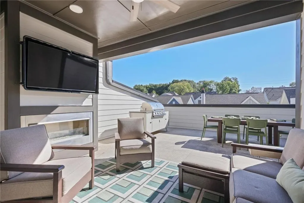 Better than a backyard, the rooftop terrace provides year-round enjoyment with an outdoor fireplace, gas line for grilling, and large dining area.