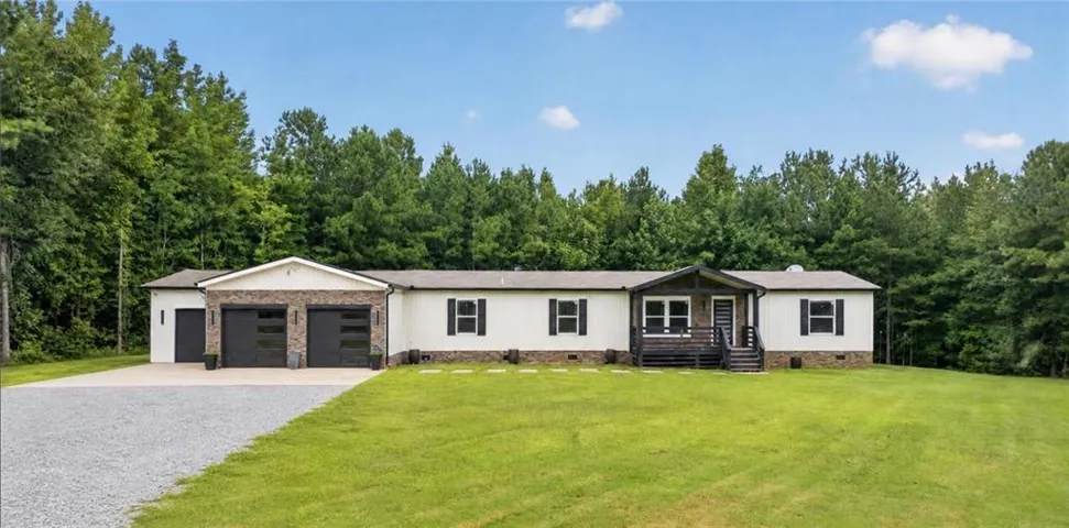 White siding exterior with black shutters and trim