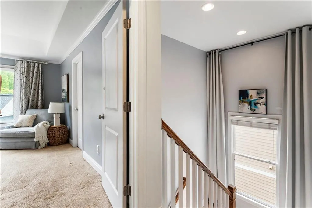 Hall with ornamental molding, carpet floors, and recessed lighting