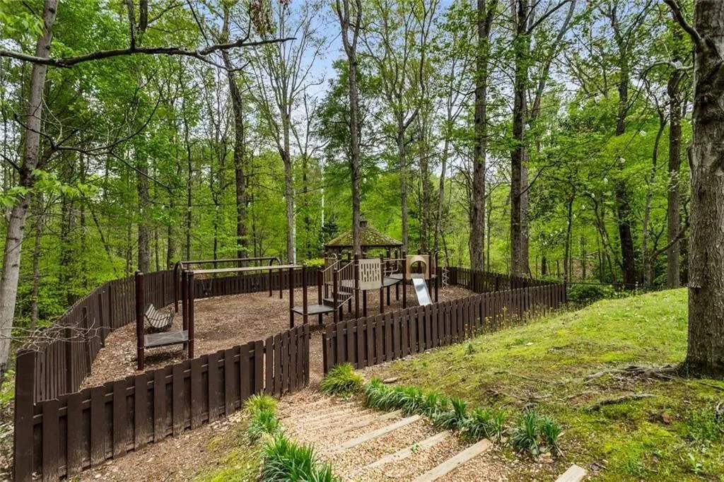 Private gated playground and giant dog park exclusively for the subdivision. Gazebo lights come on over the whole area at dusk.