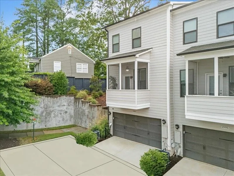 View of front facade featuring a garage and driveway