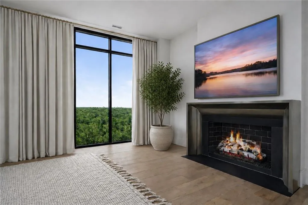 Cast stone Francois fireplace, centering the expansive living room open to the Kitchen and sweeping views from every window in this corner Penthouse residence.