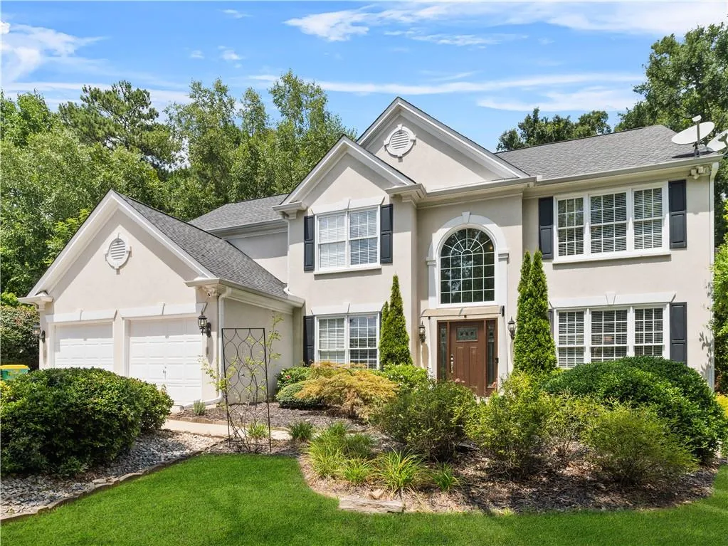 View of front of property featuring a garage