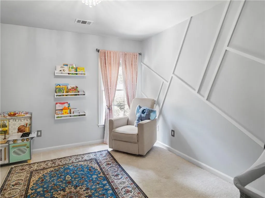 Sitting room with light colored carpet