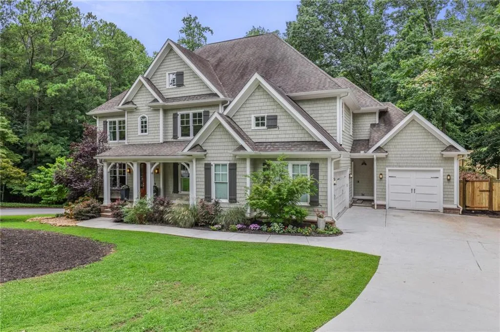 Craftsman-style home featuring a garage and a front yard