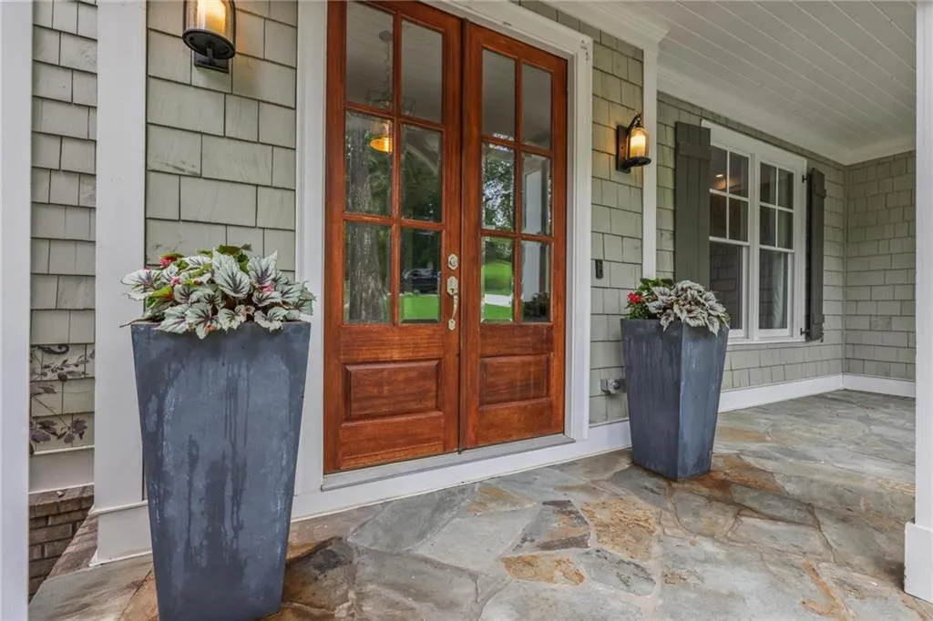Doorway to property featuring a porch