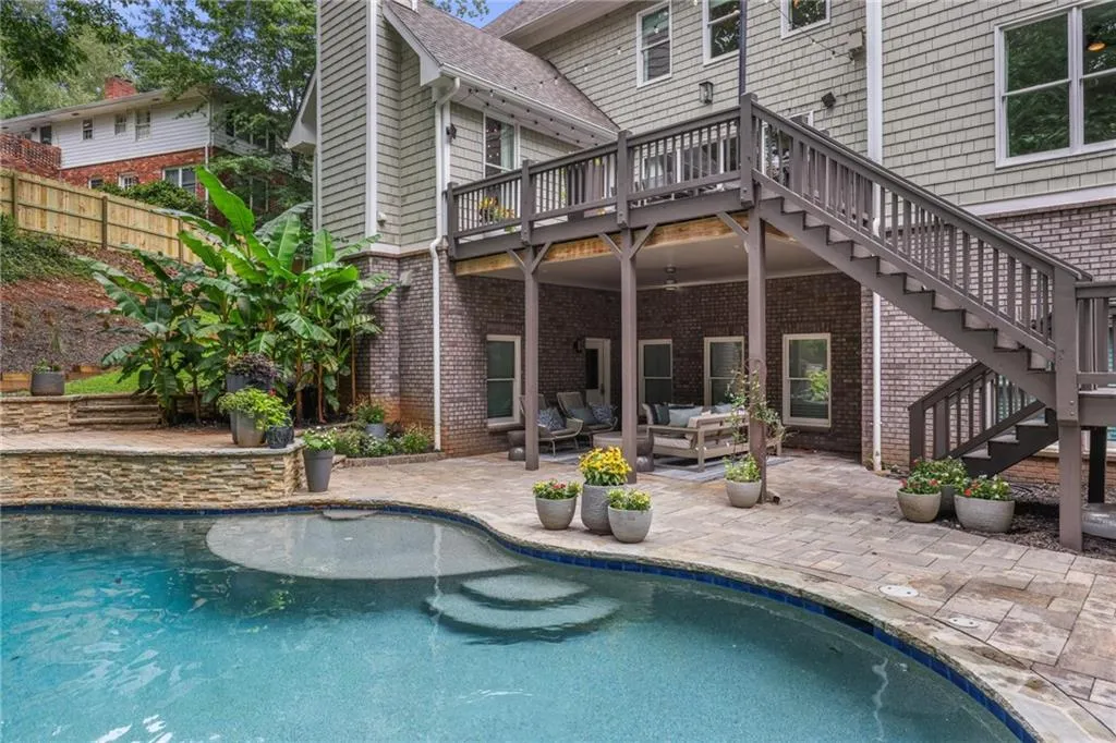 View of swimming pool featuring a patio, a deck, and outdoor lounge area