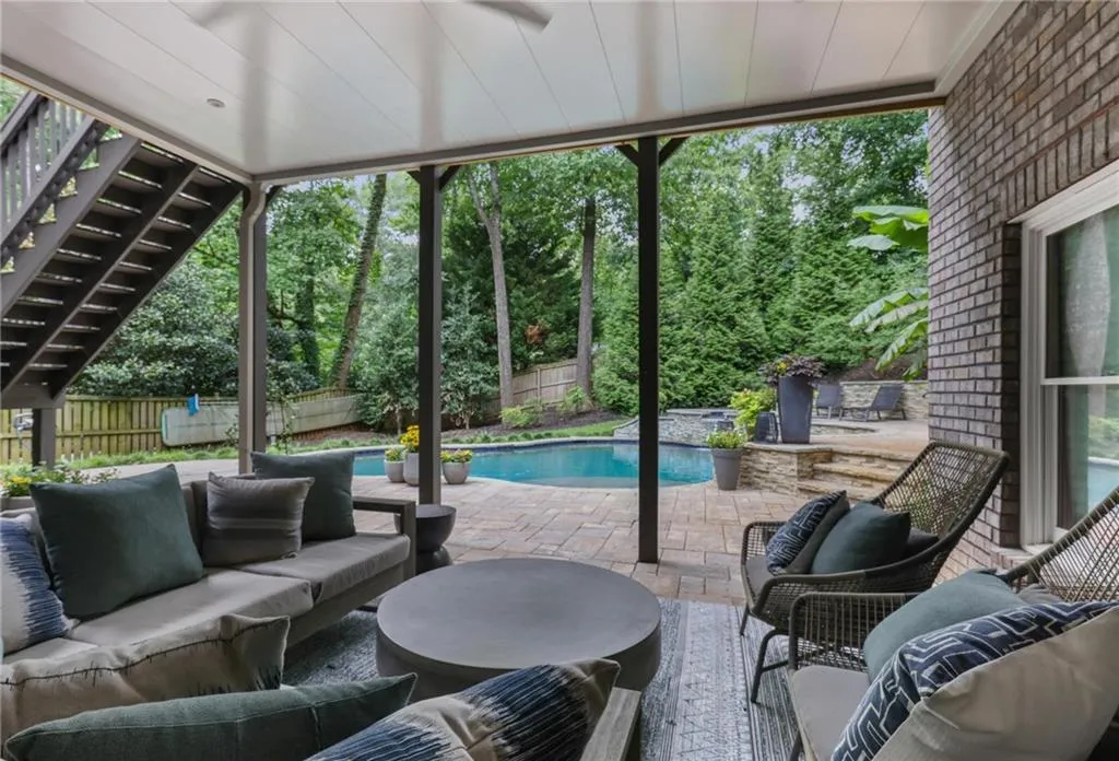 View of patio / terrace featuring an outdoor hangout area and a fenced in pool