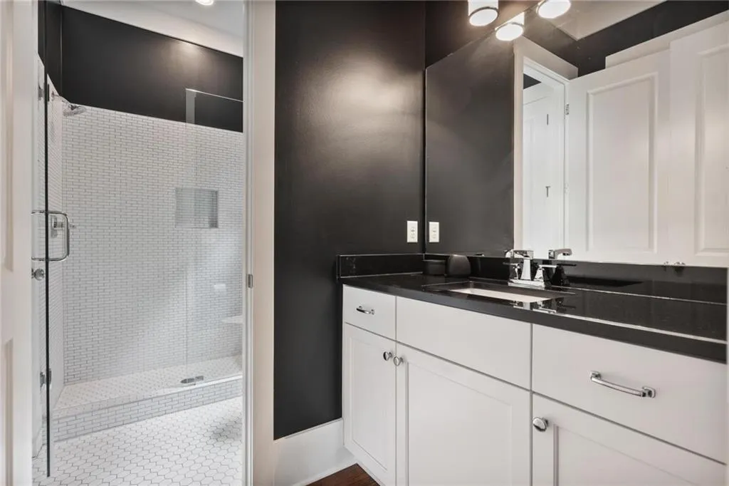 Bathroom with vanity and an enclosed shower