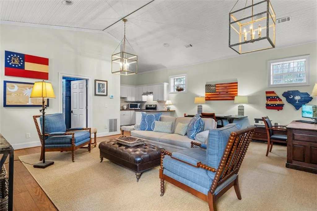 Great room in Carriage house has wide pine flooring