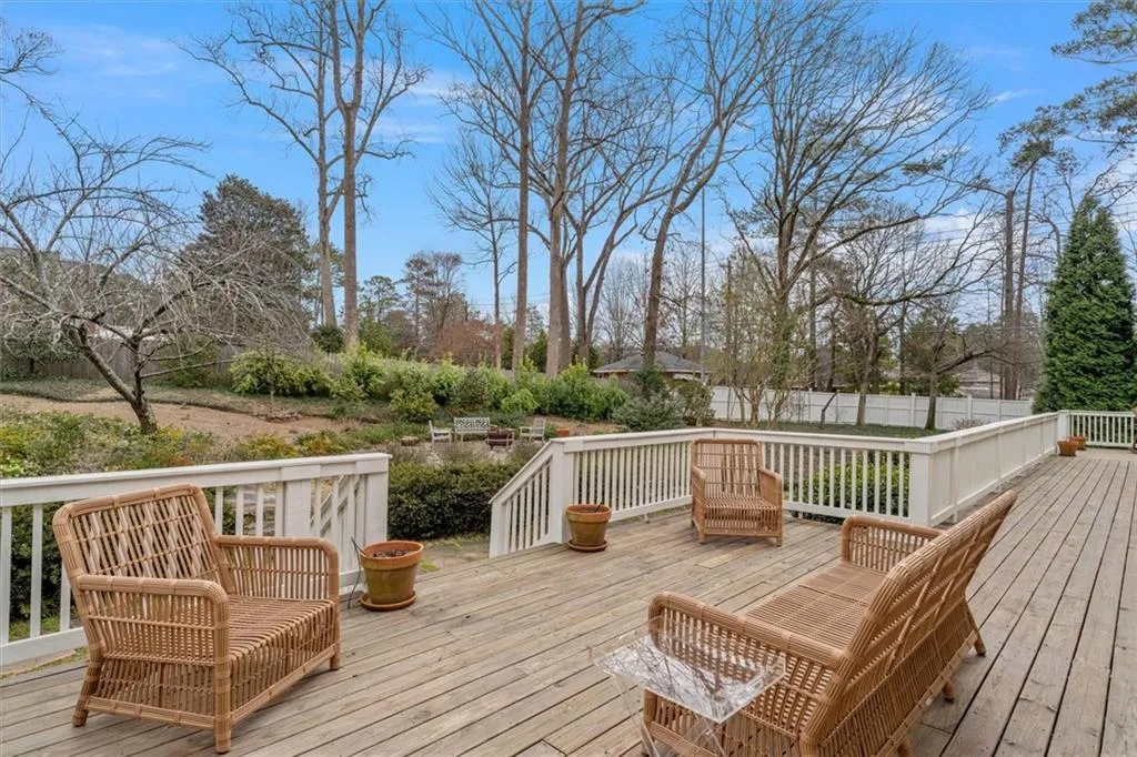 Back deck overlooks private, fenced professionally landscaped back yard
