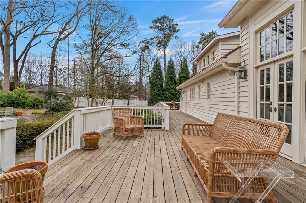 Back deck wraps around to side of home