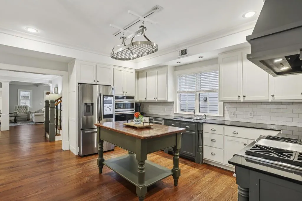 Gourmet Kitchen With Granite Counters, Stainless Steel Appliances, & A Bright Breakfast Room