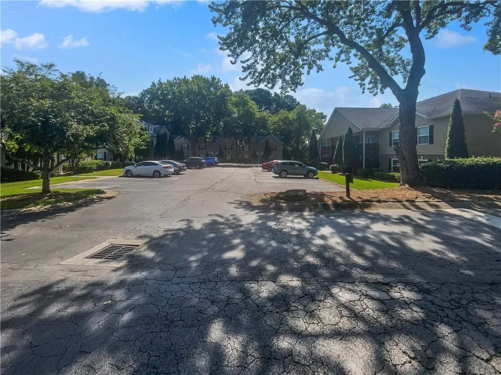 View of asphalt road with a residential view