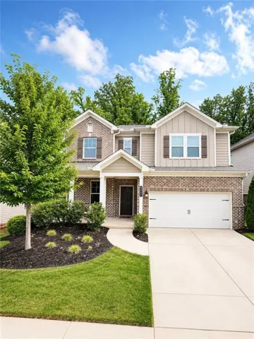 Brick and siding exterior with a two-car garage