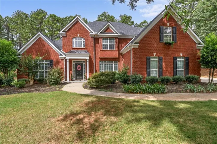 Classic brick exterior with a prominent gabled roofline