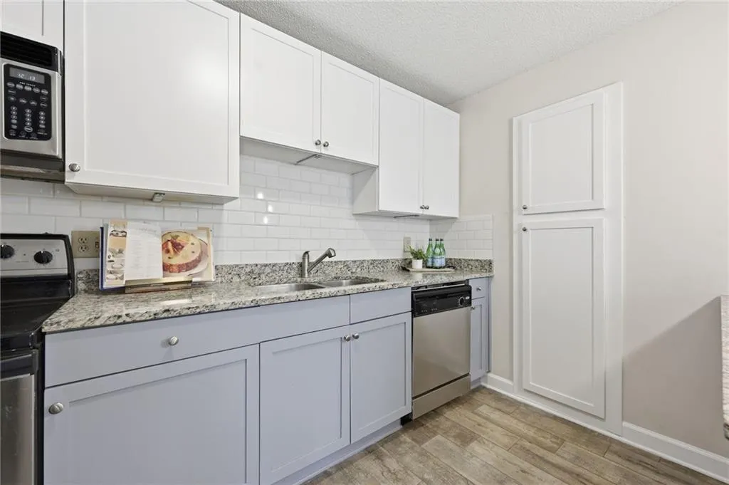 updated cabinets, counter tops, and backsplash
