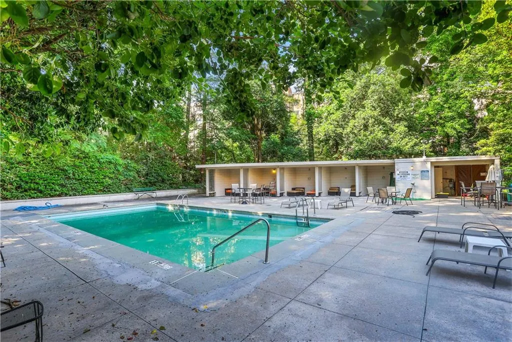 Community pool featuring a patio