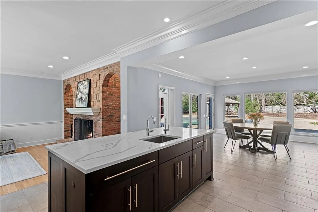 Open flow, light-filled kitchen, with view to fireside family room, and light-filled kitchen dining area.