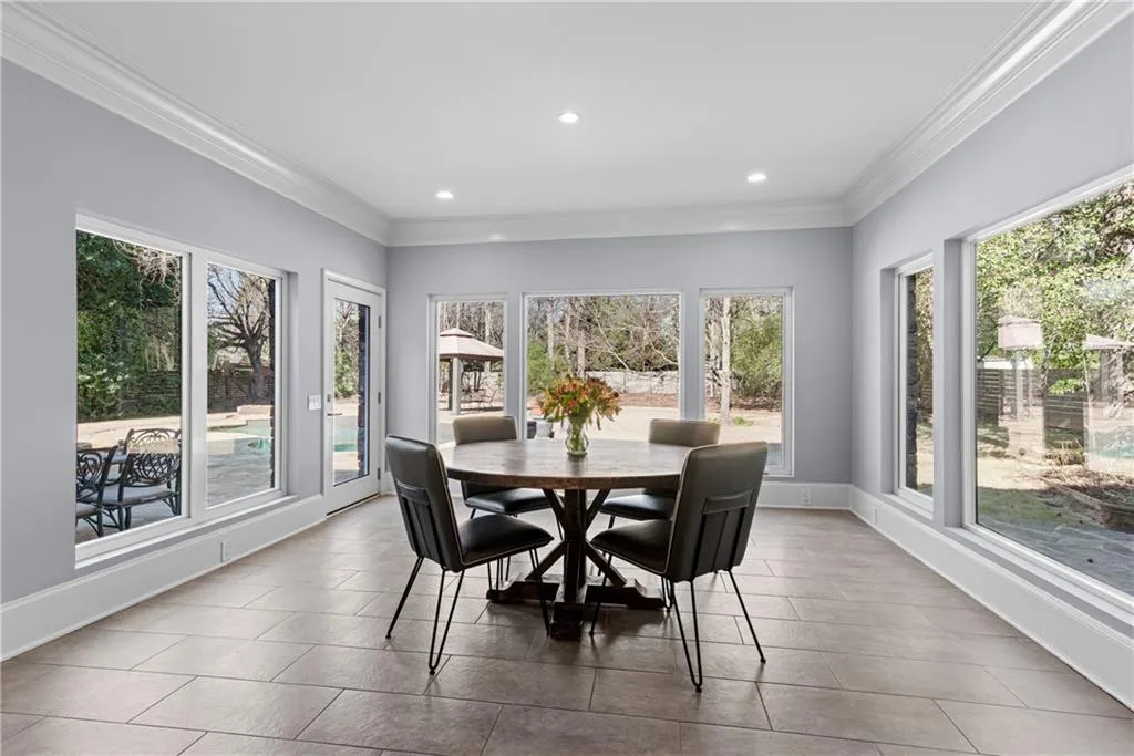 Eat in kitchen - light filled with wall of windows all around -walk out to private level backyard resort