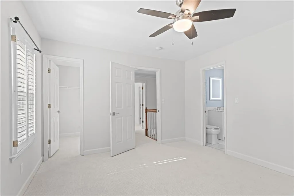 Secondary bedroom, large walk in closet and shared jock n jill bathroom.
