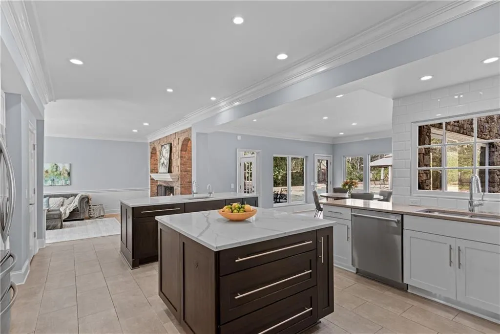 Dual islands open to fireside family room
