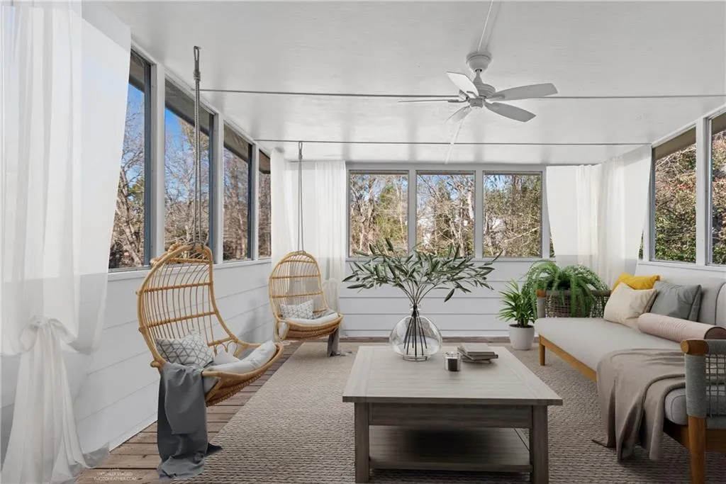 Gorgeous private sunroom off the primary bedroom. Virtually staged for visual reference.
