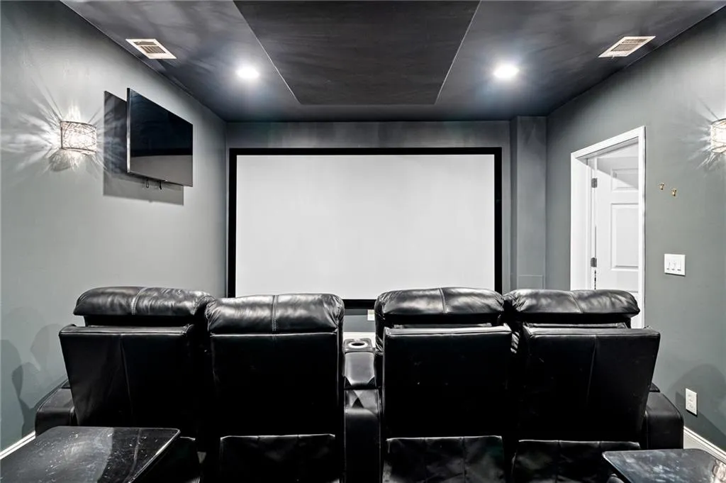 Home theater room featuring baseboards Home theater room featuring baseboards