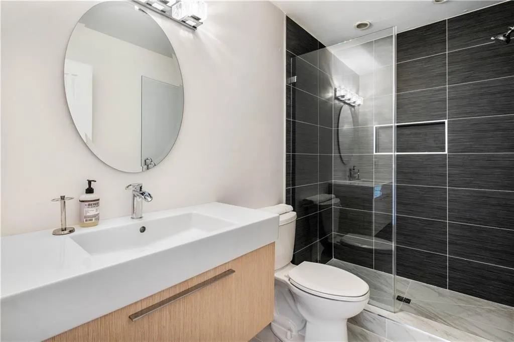 Full bath featuring vanity and a walk in shower Full bath featuring vanity and a walk in shower