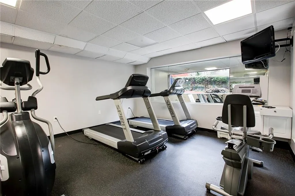 Workout room with a drop ceiling