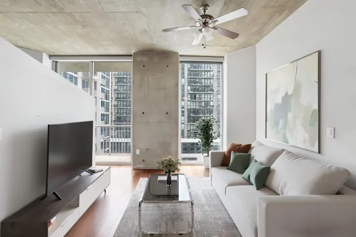 Open-Concept Living Area Flows Onto A Private Covered Balcony