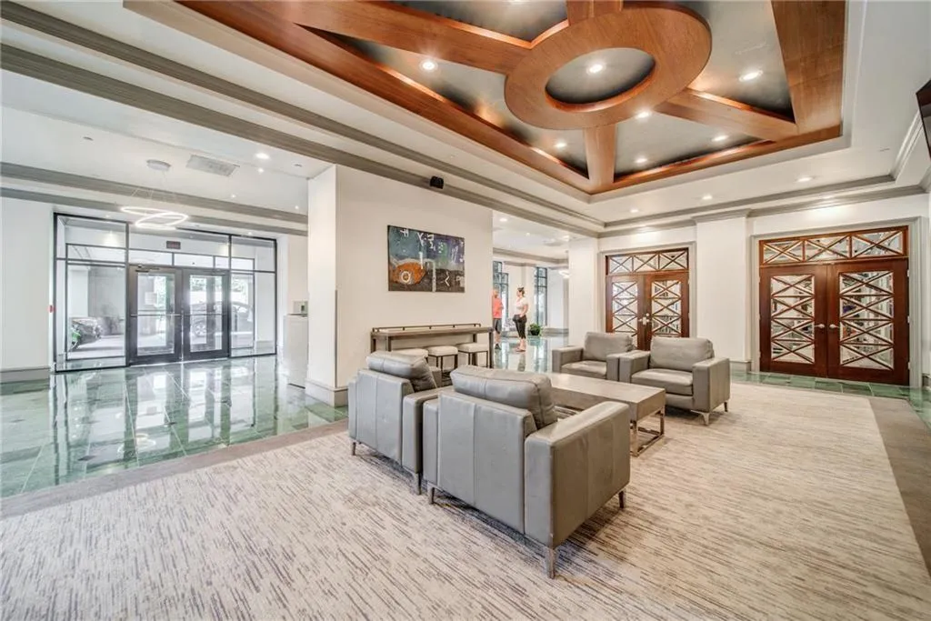 Common area with recessed lighting and ornamental molding