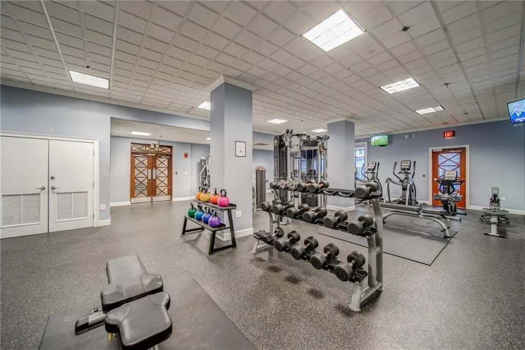 Workout area with a paneled ceiling