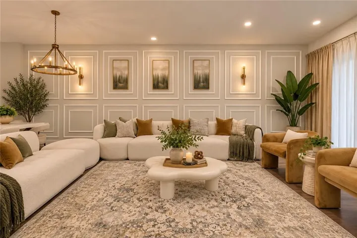 Wall paneling with decorative molding, recessed lighting, and a chandelier / Image AI modified