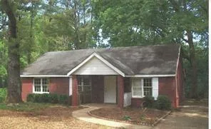 built before 1978.  Red brick exterior with white trim details