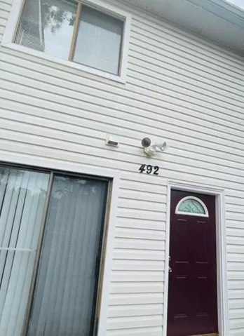 White horizontal siding with contrasting trim