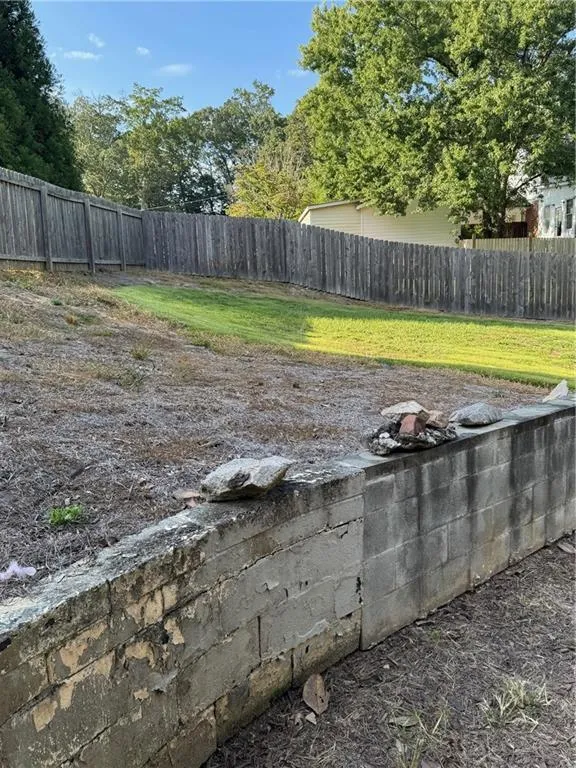 View of fenced backyard