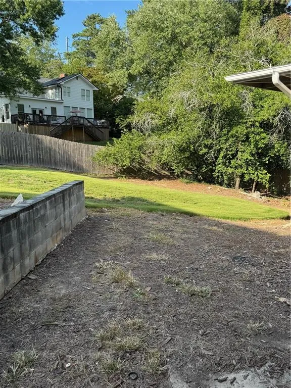 View of yard with a deck