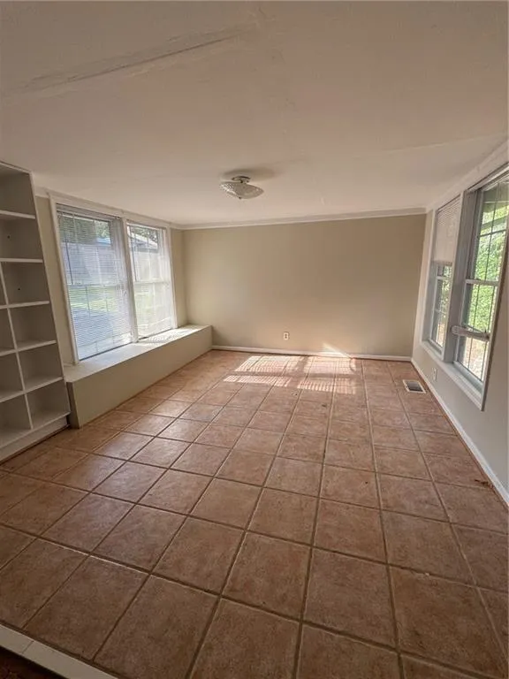 Empty room with tile patterned floors