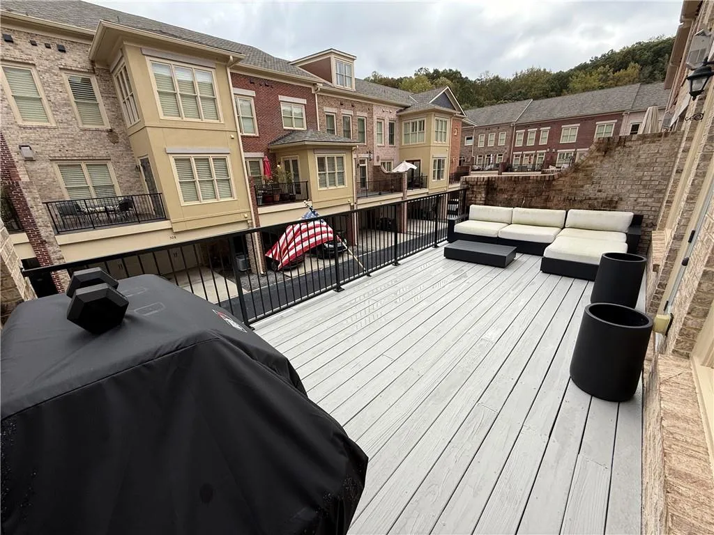 Deck with area for grilling, outdoor lounge area, and a residential view