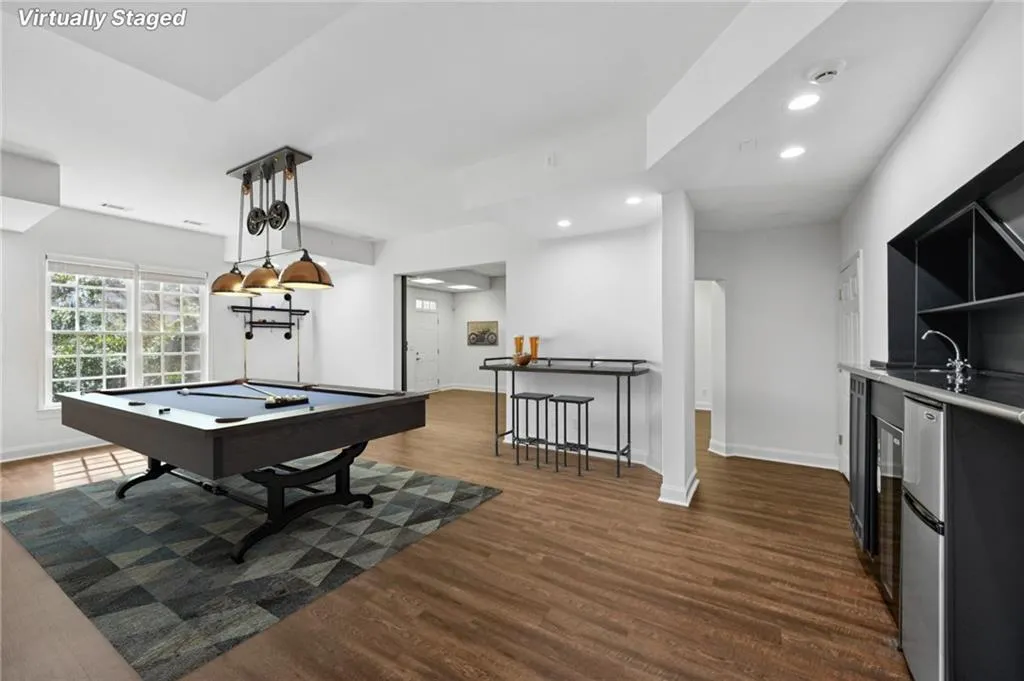 Rec room with dark wood-style floors, billiards table, and recessed lighting